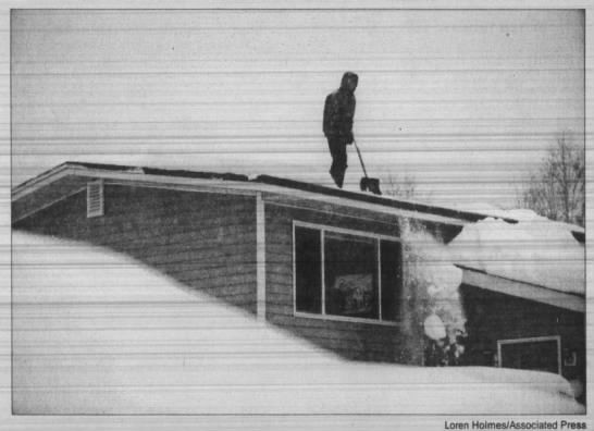 14-year-old shovels snow off roof